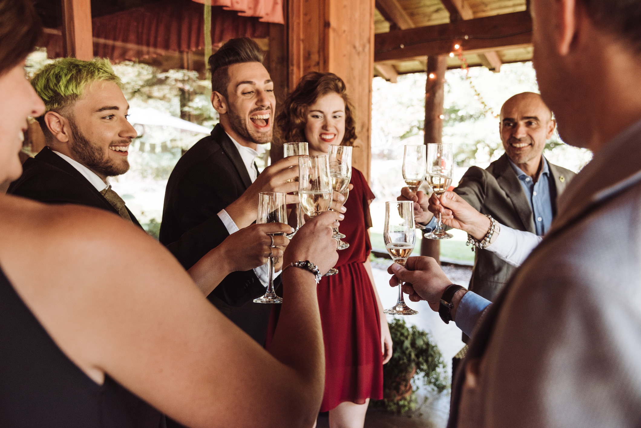 stock image of a wedding party cheersing