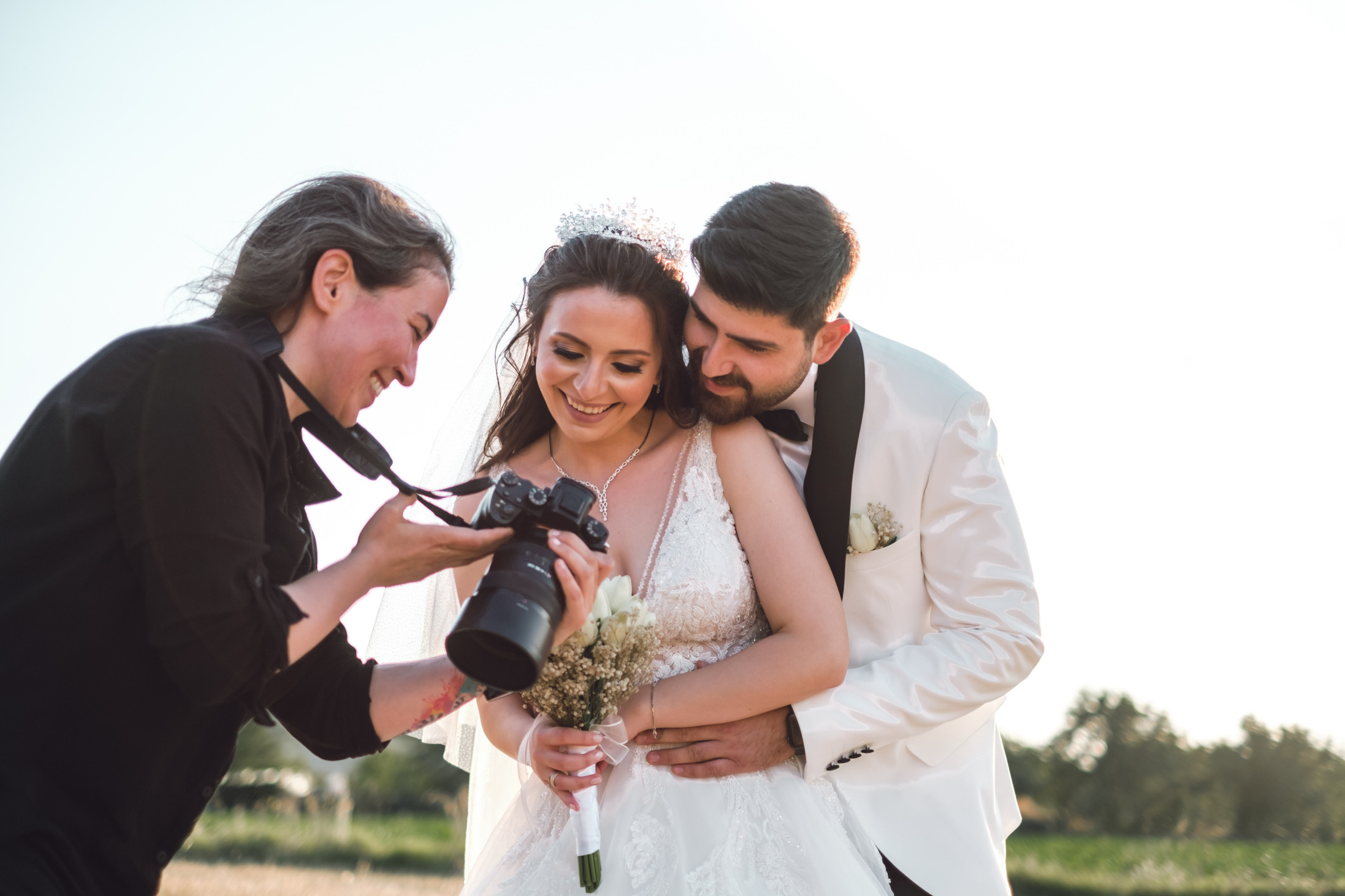 photographer with married couple